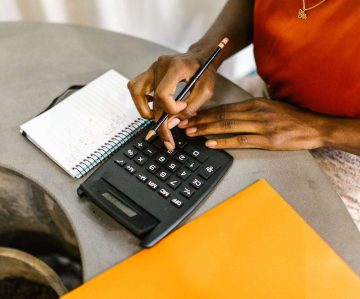 Woman Uses Calculator